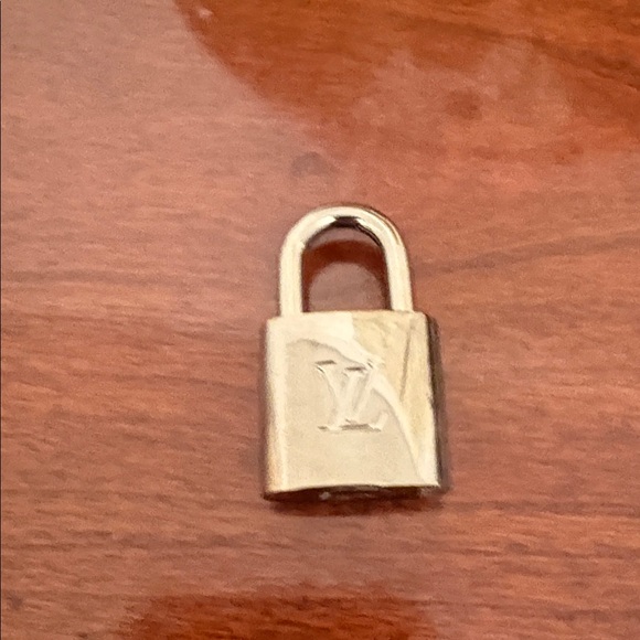 Louis Vuitton Accessories - Louis Vuitton Shiny Silver Lock